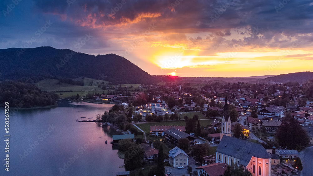 Schliersee lake in south Germany in the Alps with magical colorful sunset from drone view