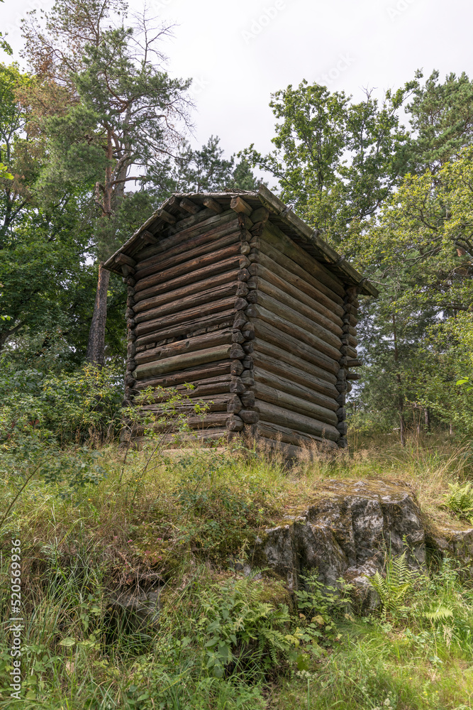 Old small log shed house for hop, a sunny summer day in Stockholm Old small log shed house for hop, a sunny summer day in Stockholm