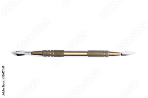 Cuticle nail pusher isolated on a white background. Manicure and pedicure nail care tool. Top view.