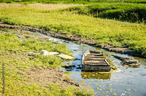 Old boat on a lake in National Park - Sodros on a sunny day photo