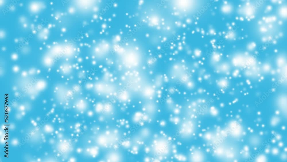 White snow particles falling against blue background White snow particles falling against blue background