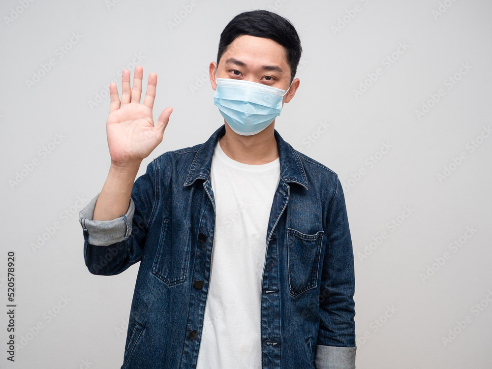 Hi,Young man jeans shirt wear medical mask show hand hello,Nice to meet you Hi,Young man jeans shirt wear medical mask show hand hello,Nice to meet you