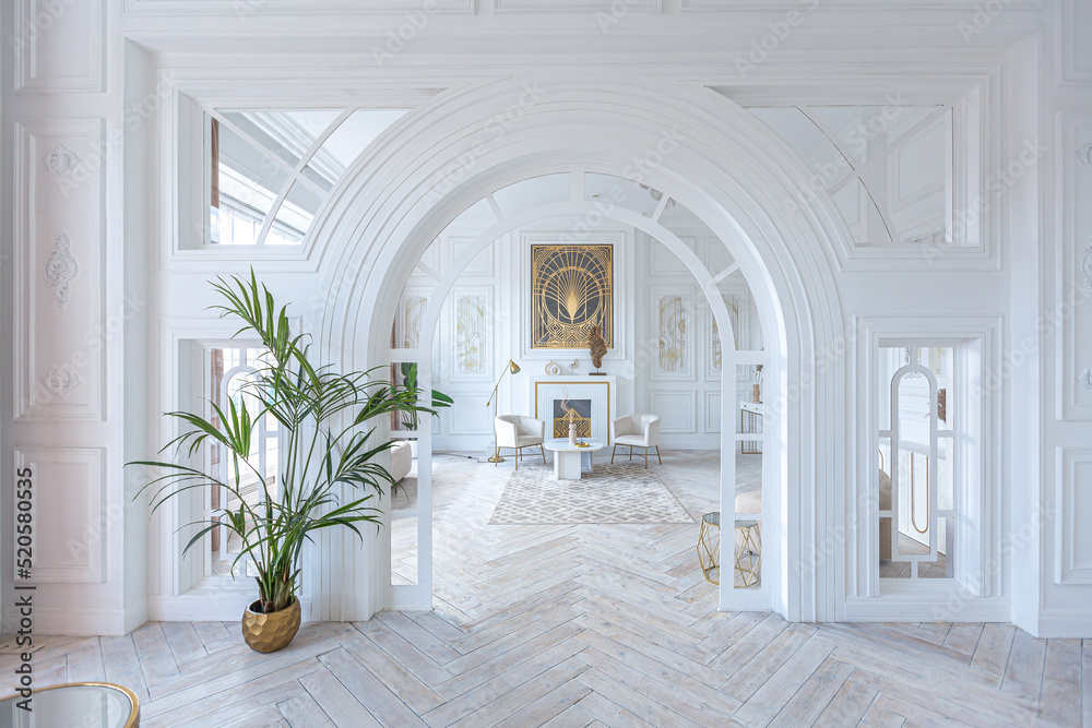 snow-white luxury apartment interior with Egyptian-style decor with light stylish furniture. huge panoramic windows and an archway. minimalism and simplicity with the elegance of modern housing design