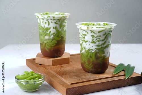 es Cendol or lod chong is a sweet ice dessert made from pandan short vermicelli with coconut milk, and palm sugar syrup.popular in Indonesia and other Southeast Asia such as thailand,Brunei, Malaysia  photo