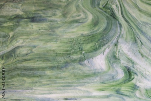 A green quartz with a polished surface. photo