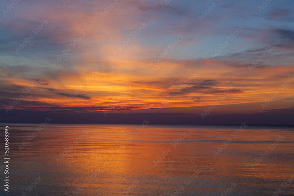 Panoramic view of seascape sunset with lingering rays of the sun at the Atlantic Ocean in Woodland State Park, Long Island the USA. High-quality photo