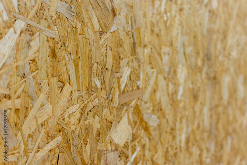 Close up to osb or compressed wood board shot in perspective