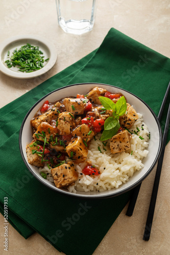 Tofu with white rice, stir fry tofy meat in bowl. Healthy vegan lifestyle food photo
