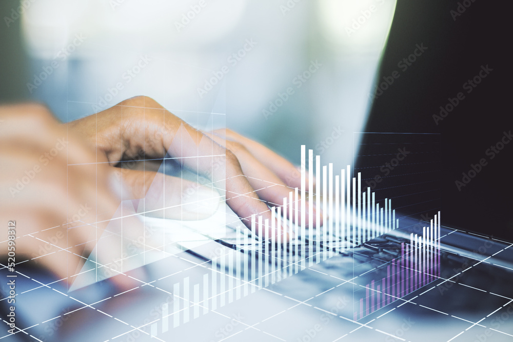 Abstract creative financial graph with hand typing on laptop on background, financial and trading concept. Multiexposure Abstract creative financial graph with hand typing on laptop on background, financial and trading concept. Multiexposure