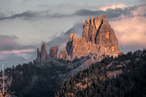Sunset on 5 Torri (Five Towers) mountains in the Dolomites with some colored clouds, Dolomites, Italy photo