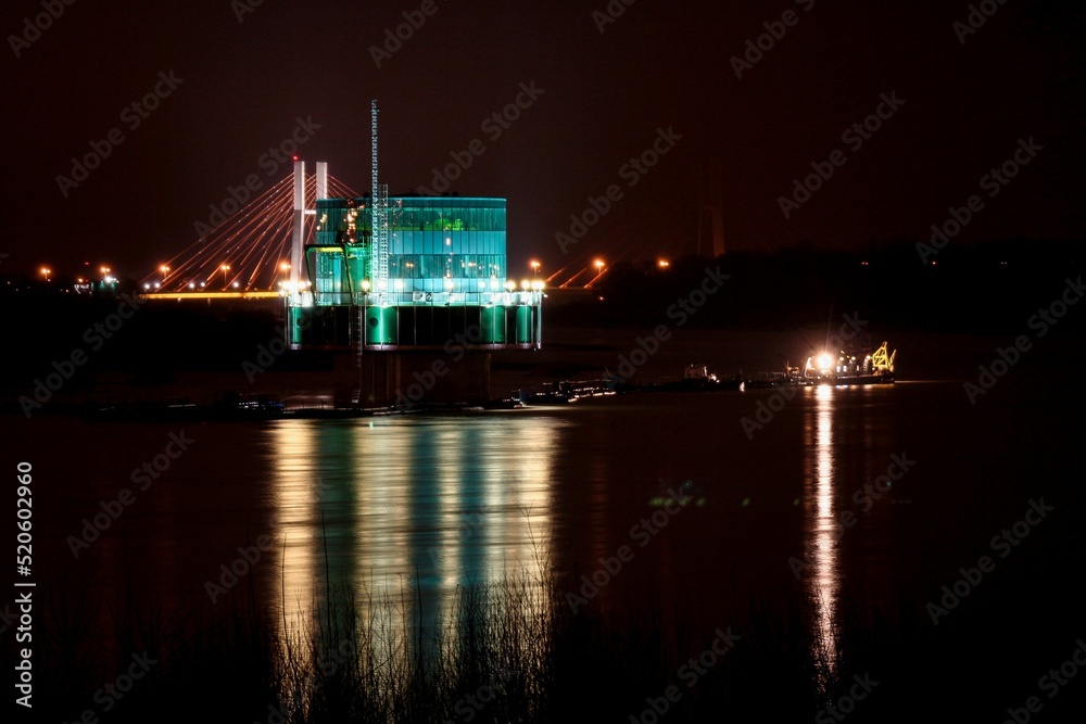 View of Warsaw water intake "Gruba Kaska" at night - obrazy, fototapety, plakaty 