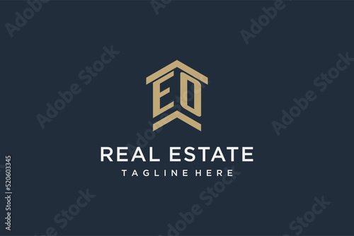 Initial EO logo for real estate with simple and creative house roof icon logo design ideas photo