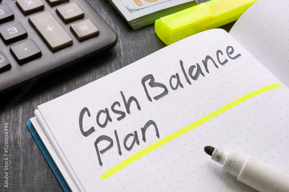 Notepad with cash balance plan and calculator.