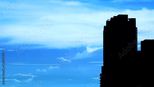 Footage video. Beautiful sky timelap with shadowy buildings, silhouettes. photo