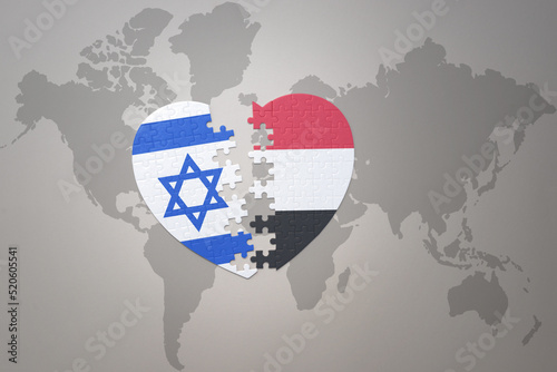 puzzle heart with the national flag of yemen and israel on a world map background.Concept.