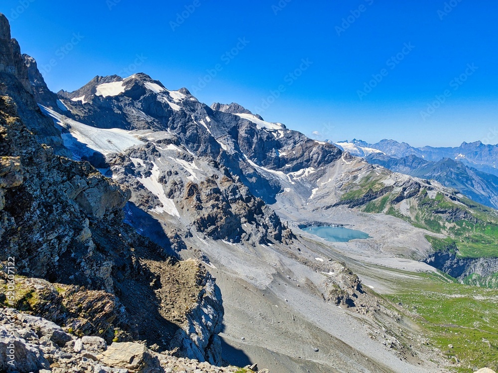 great panorama of the klausen pass and towards clariden. Hiking on the gemsfairenstock. Mountaineering in summer.