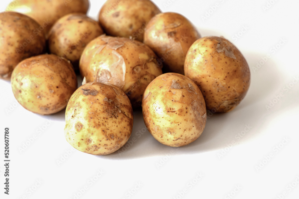 Heap of young potatos isolated on white background Heap of young potatos isolated on white background