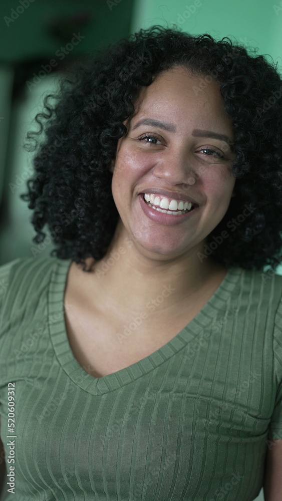 Portrait of a happy black woman smiling at camera. a hispanic latin person Portrait of a happy black woman smiling at camera. a hispanic latin person
