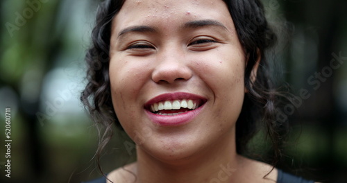 Hispanic woman portrait smile. Joyful casual teen girl laughing  real people series