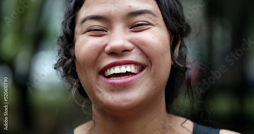 Hispanic woman portrait smile. Joyful casual teen girl laughing  real people series