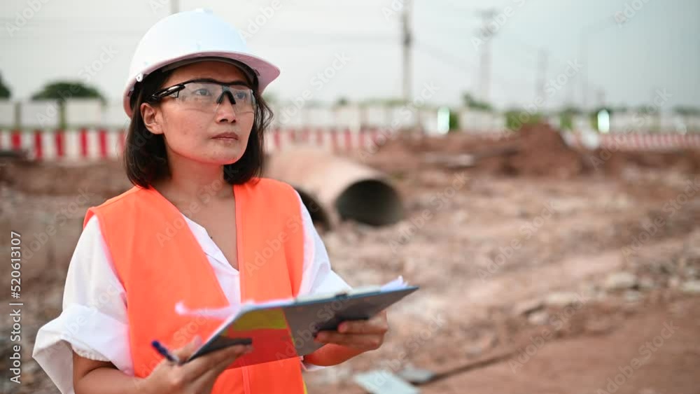Civil engineers working at a construction site,The company manager supervises the road construction.