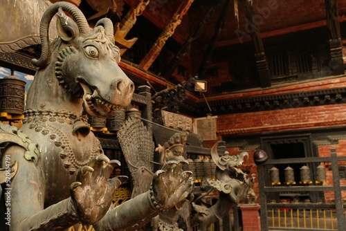 Closeup shot of bronze sculptures in the Rudra Varna Mahavihar  buddhist temple in Lalitpur photo