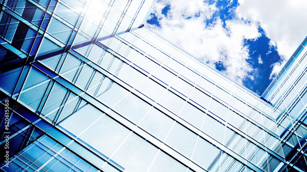 Obraz premium Glass building. Transparent glass wall of office building. Modern office building with glass facade on a clear sky background. 3d Rendering