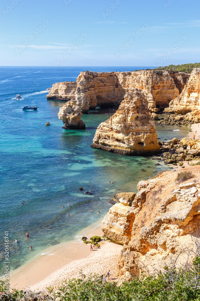 Fototapeta premium Algarve beach Praia da Marinha sea ocean portrait format vacation in Portugal