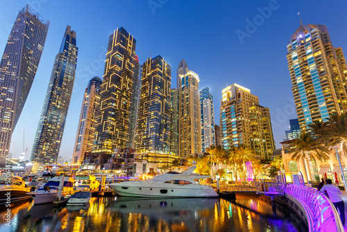 Dubai Marina skyline yacht harbor architecture travel at night twilight in United Arab Emirates