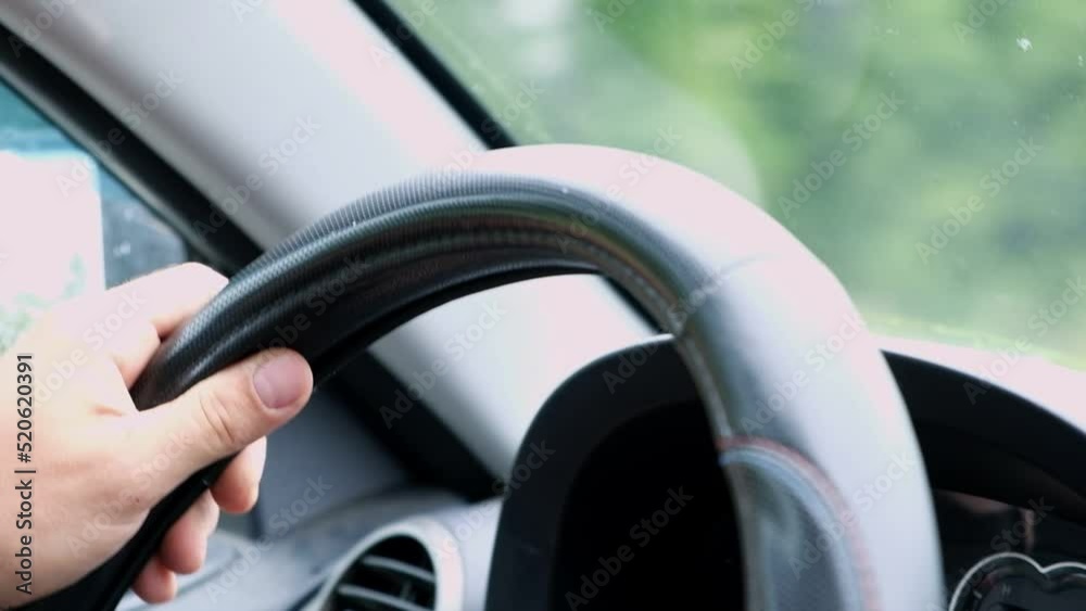 Hands on wheel. Driving Car. Unrecognizable Driver Holding Steering Wheel Sitting In New Auto. Selective Focus, Cropped. Male hands holding steering wheel of a car. Travel concept. Hands on wheel. Driving Car. Unrecognizable Driver Holding Steering Wheel Sitting In New Auto. Selective Focus, Cropped. Male hands holding steering wheel of a car. Travel concept.