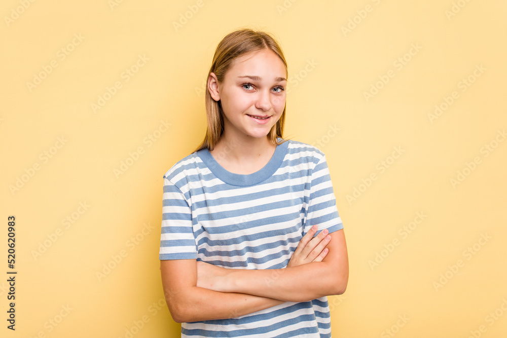 Young caucasian girl isolated on yellow background laughing and having fun. Young caucasian girl isolated on yellow background laughing and having fun.