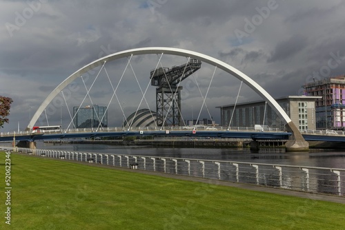 View of Cylde Arc against modern buildings in Glasgow, Scotland on a cloudy day photo