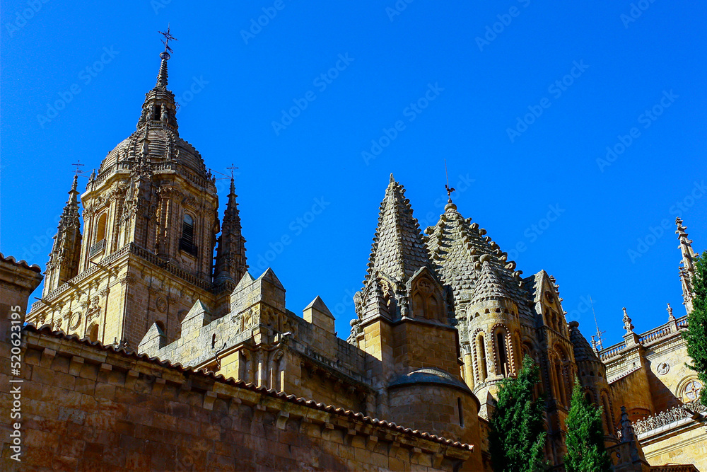 Short view of the tower of the cathedral in Salamanca, Spain, on a sunny day with a bright blue sky