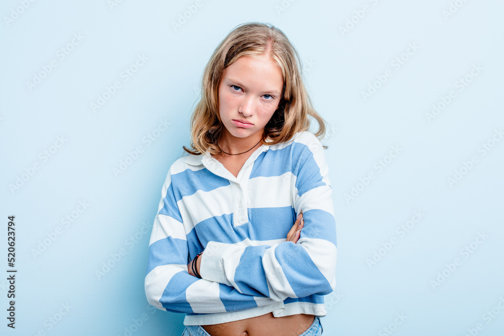 Caucasian teen girl isolated on blue background who is bored, fatigued and need a relax day. Caucasian teen girl isolated on blue background who is bored, fatigued and need a relax day.
