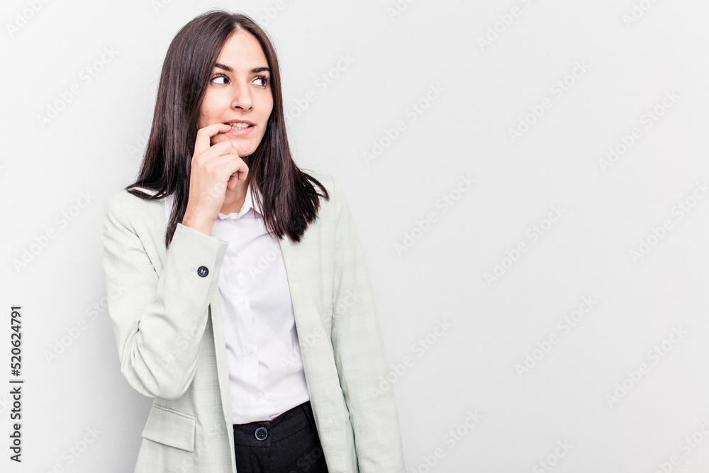 Young business caucasian woman isolated on white background relaxed thinking about something looking at a copy space. Young business caucasian woman isolated on white background relaxed thinking about something looking at a copy space.