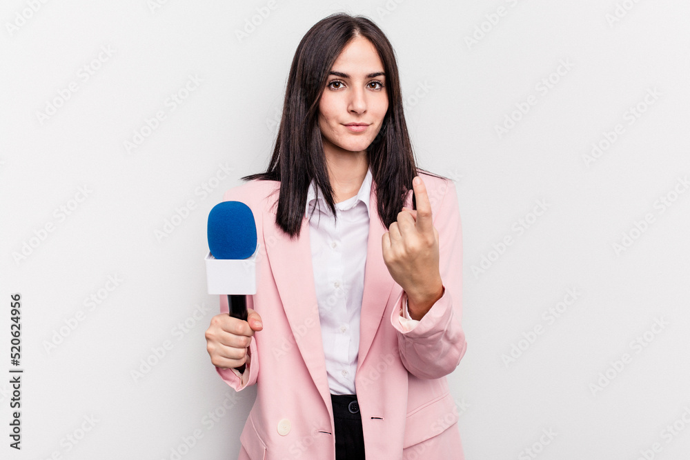 Young TV presenter caucasian woman isolated on white background pointing with finger at you as if inviting come closer. Young TV presenter caucasian woman isolated on white background pointing with finger at you as if inviting come closer.
