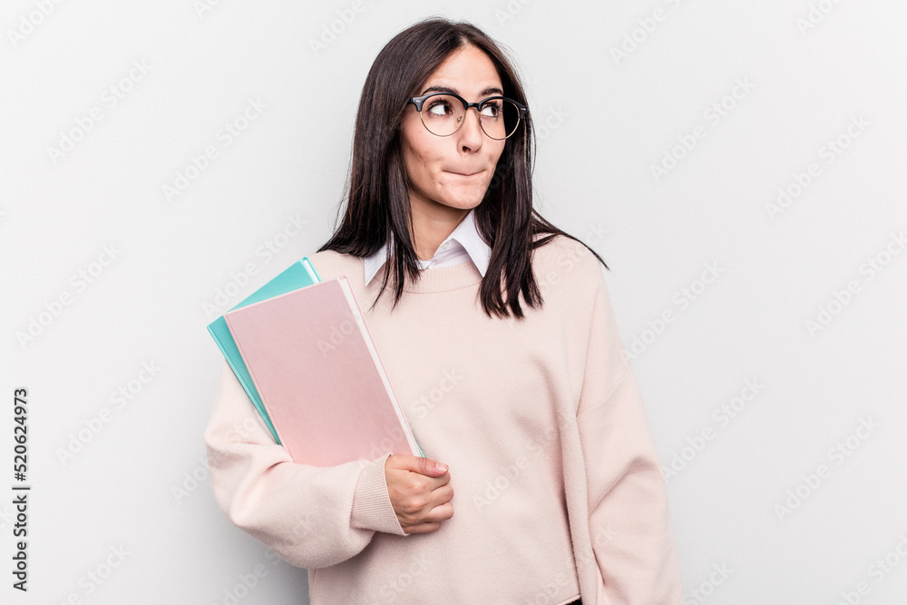 Young student caucasian woman isolated on white background confused, feels doubtful and unsure. Young student caucasian woman isolated on white background confused, feels doubtful and unsure.