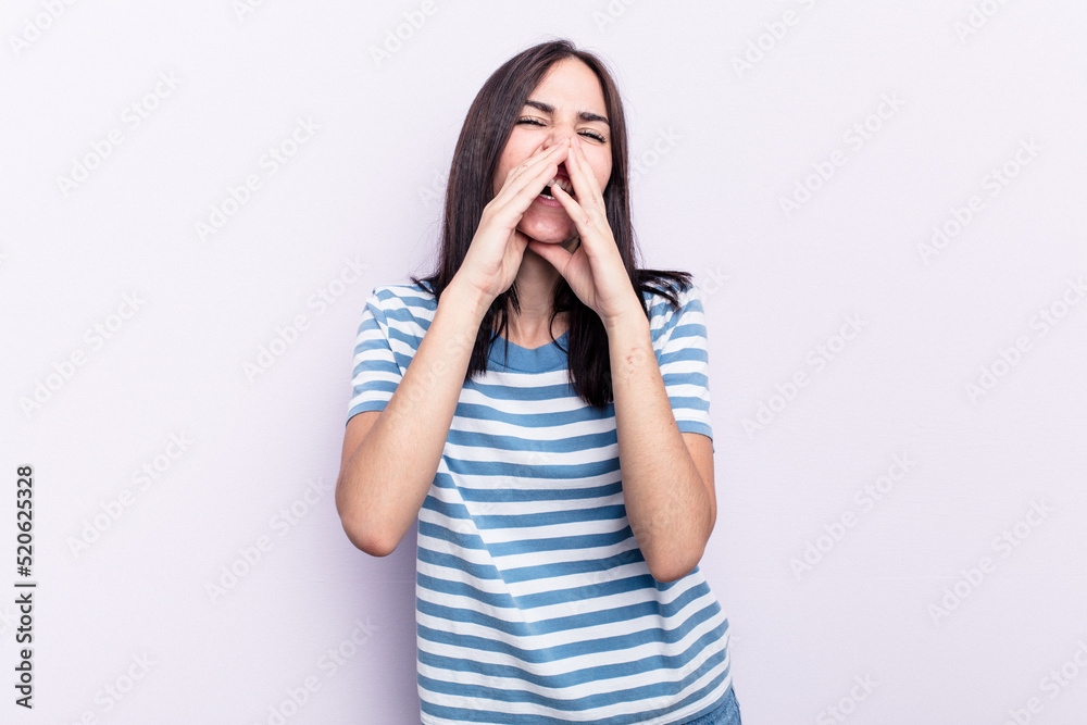 Young caucasian woman isolated on pink background saying a gossip, pointing to side reporting something. Young caucasian woman isolated on pink background saying a gossip, pointing to side reporting something.