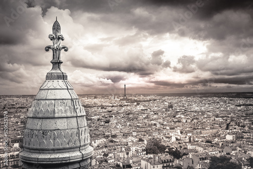 Above Paris from Sacre Couer tower in Montmartre with dramatic sky, France photo
