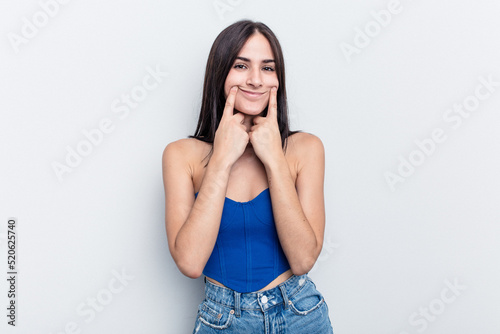 Young caucasian woman isolated on white background doubting between two options.