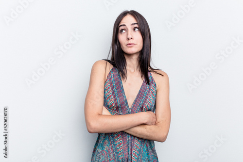 Young caucasian woman isolated on white background dreaming of achieving goals and purposes