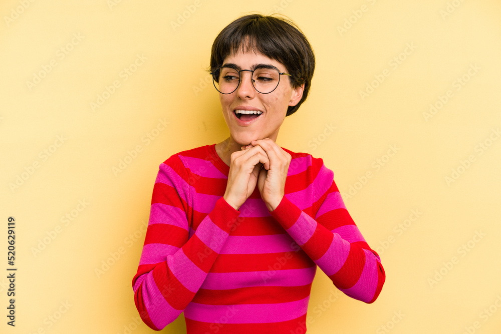 Young caucasian woman with a short hair cut isolated praying for luck, amazed and opening mouth looking to front. Young caucasian woman with a short hair cut isolated praying for luck, amazed and opening mouth looking to front.