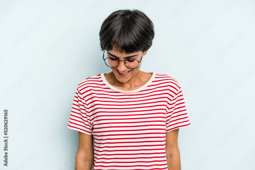 Young caucasian woman with a short hair cut isolated laughs and closes eyes, feels relaxed and happy. Young caucasian woman with a short hair cut isolated laughs and closes eyes, feels relaxed and happy.