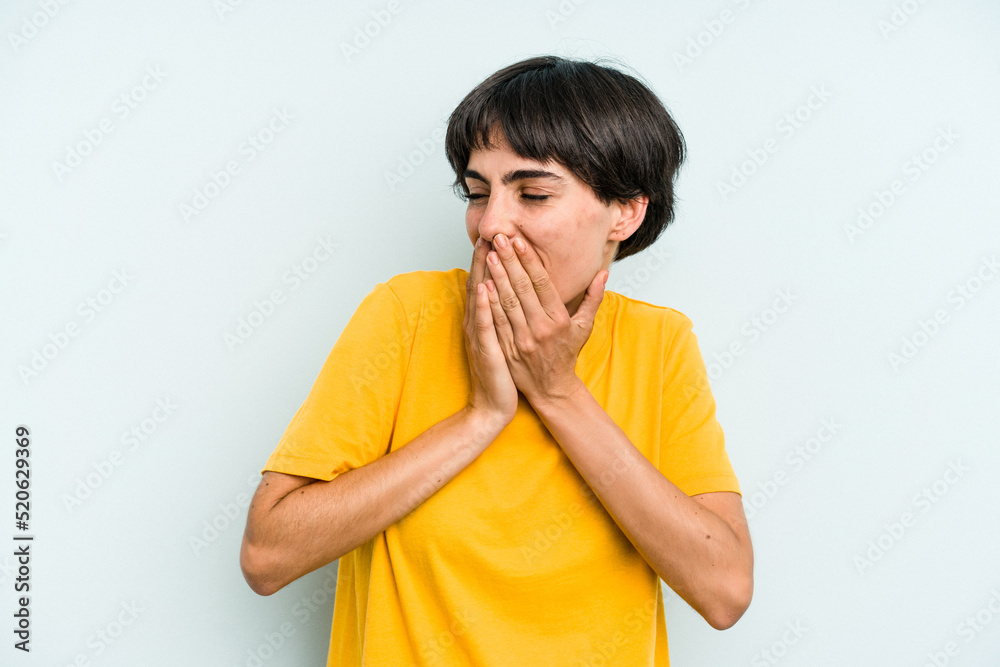 Young caucasian woman with a short hair cut isolated laughing about something, covering mouth with hands. Young caucasian woman with a short hair cut isolated laughing about something, covering mouth with hands.