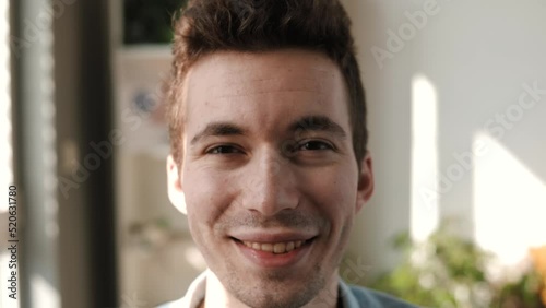 Smiling businessman looking at camera. Happy confident handsome smart young adult entrepreneur, Business portrait
