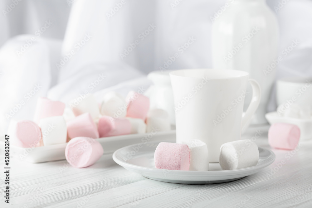 Pink and white marshmallows on a white table. Pink and white marshmallows on a white table.