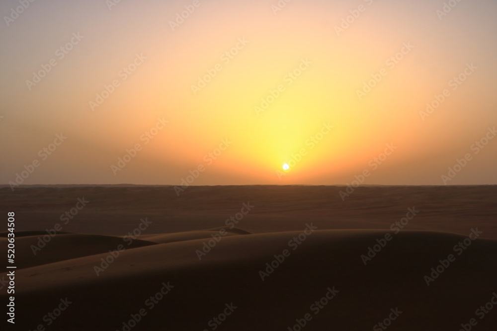 sunset in the desert Wahiba Sands in Oman