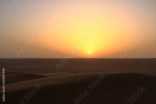 sunset in the desert Wahiba Sands in Oman © Dynamoland