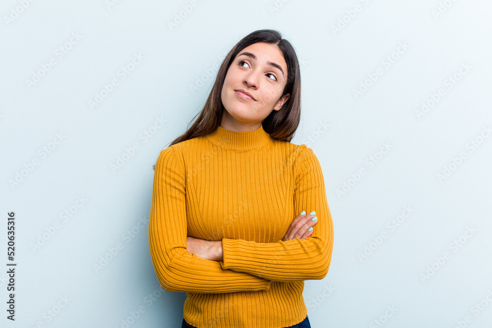 Young caucasian woman isolated on blue background dreaming of achieving goals and purposes Young caucasian woman isolated on blue background dreaming of achieving goals and purposes