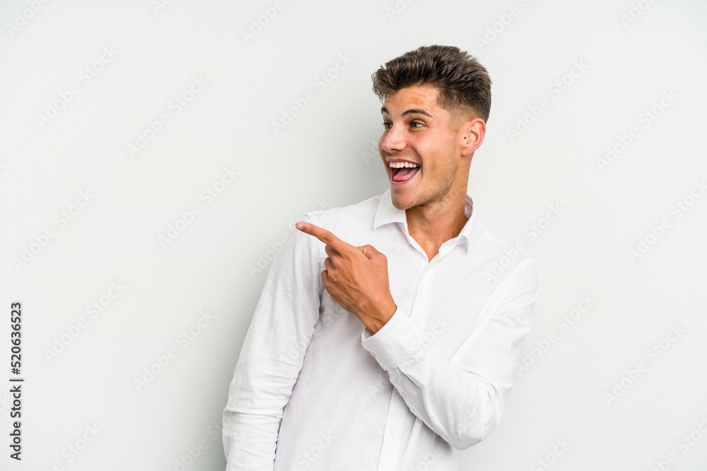 Young caucasian man isolated on white background looks aside smiling, cheerful and pleasant. Young caucasian man isolated on white background looks aside smiling, cheerful and pleasant.